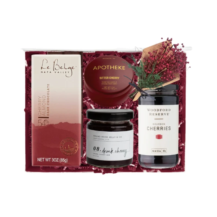 Eat, Drink and Be Cherry holiday gift box in a moody burgundy palette