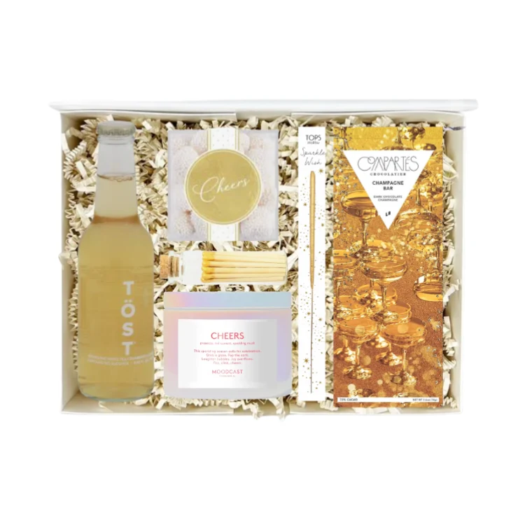 Holiday Cheer gift box with sparkling tea, champagne gummies, dark chocolate, sparkler wand, candle and matches