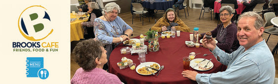 seniors enjoyin a meal around a table