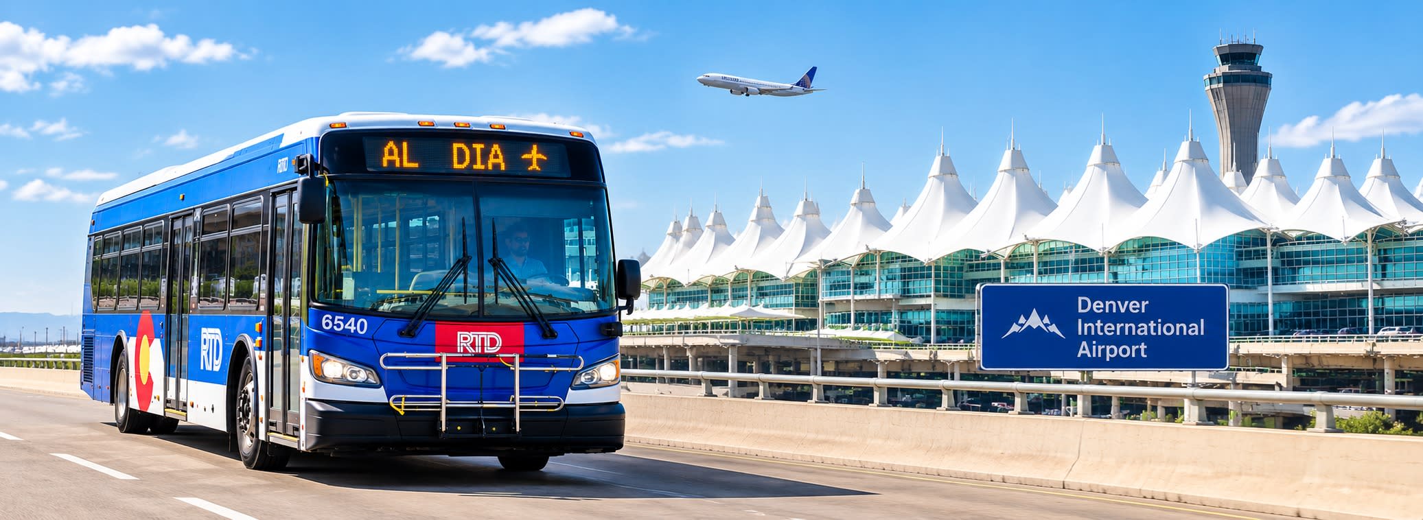 RTD bus featuring AL DIA text on the front marquee traveling on a street in front of the Denver airport with white tent roof architecture in the background. 