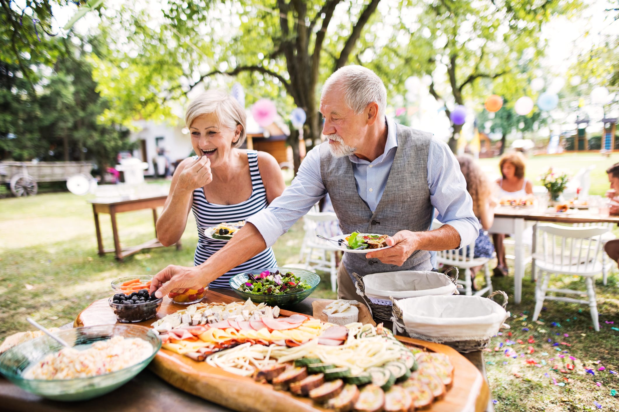 Seniors at a picnic eating well