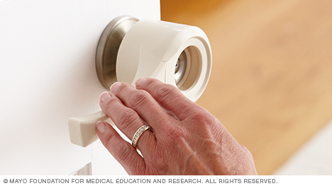 Photo of a lever that attaches to doorknobs.