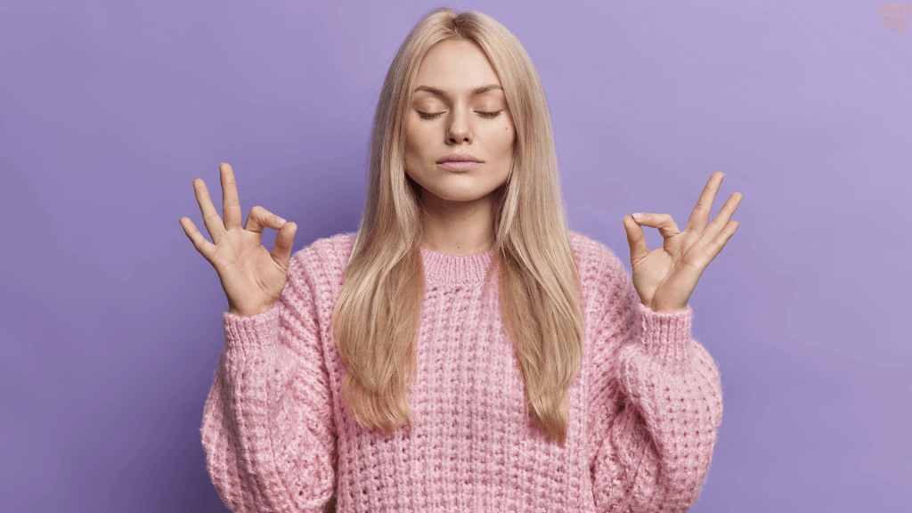 woman meditating on purple background