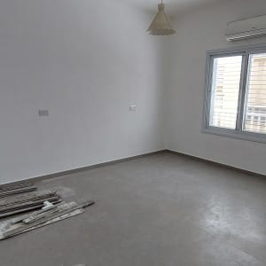Empty room with window and air conditioner