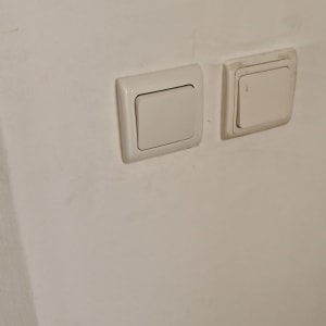 Two light switches on a wall