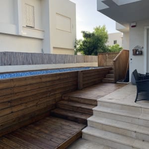 wooden deck and stairs in a garden area