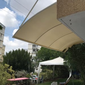 awning extending from a building with a curved design