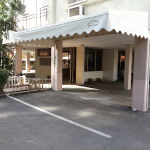 awning covering entrance with scalloped edge