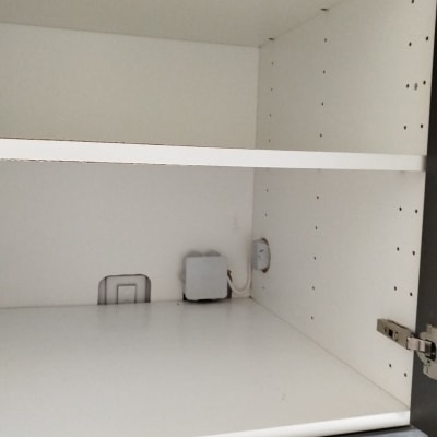 Electrical box and wires inside a cabinet