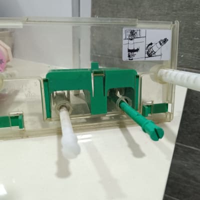 plumbing fixture with green and white components