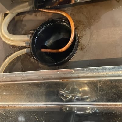 pipes and a metal container with water inside