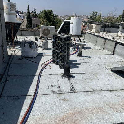 גלילי זפת על גג לאיטום