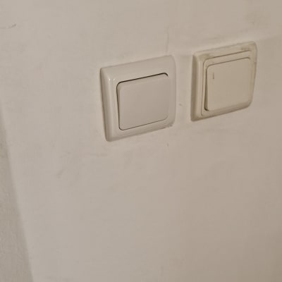 Two light switches on a wall