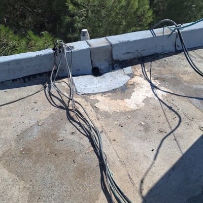 תיקון איטום נקודתי סביב פתח ניקוז על גג שטוח
