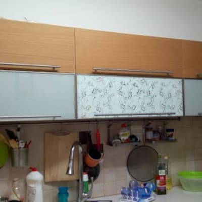 kitchen cabinets with utensils and sink