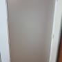 Frosted glass door with metal handle