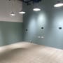 empty room with tiled floor and hanging lights