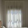 Curtains hanging in front of a window