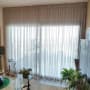 curtain covering large window in living room