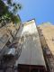 עבודות בסנפלינג לתיקון טיח ושיפוץ חזית בניין מגורים