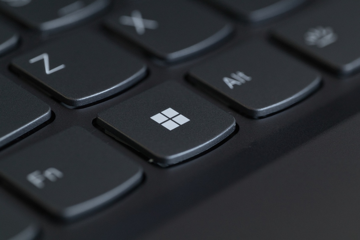Close-up of the Windows key on a black laptop keyboard.
