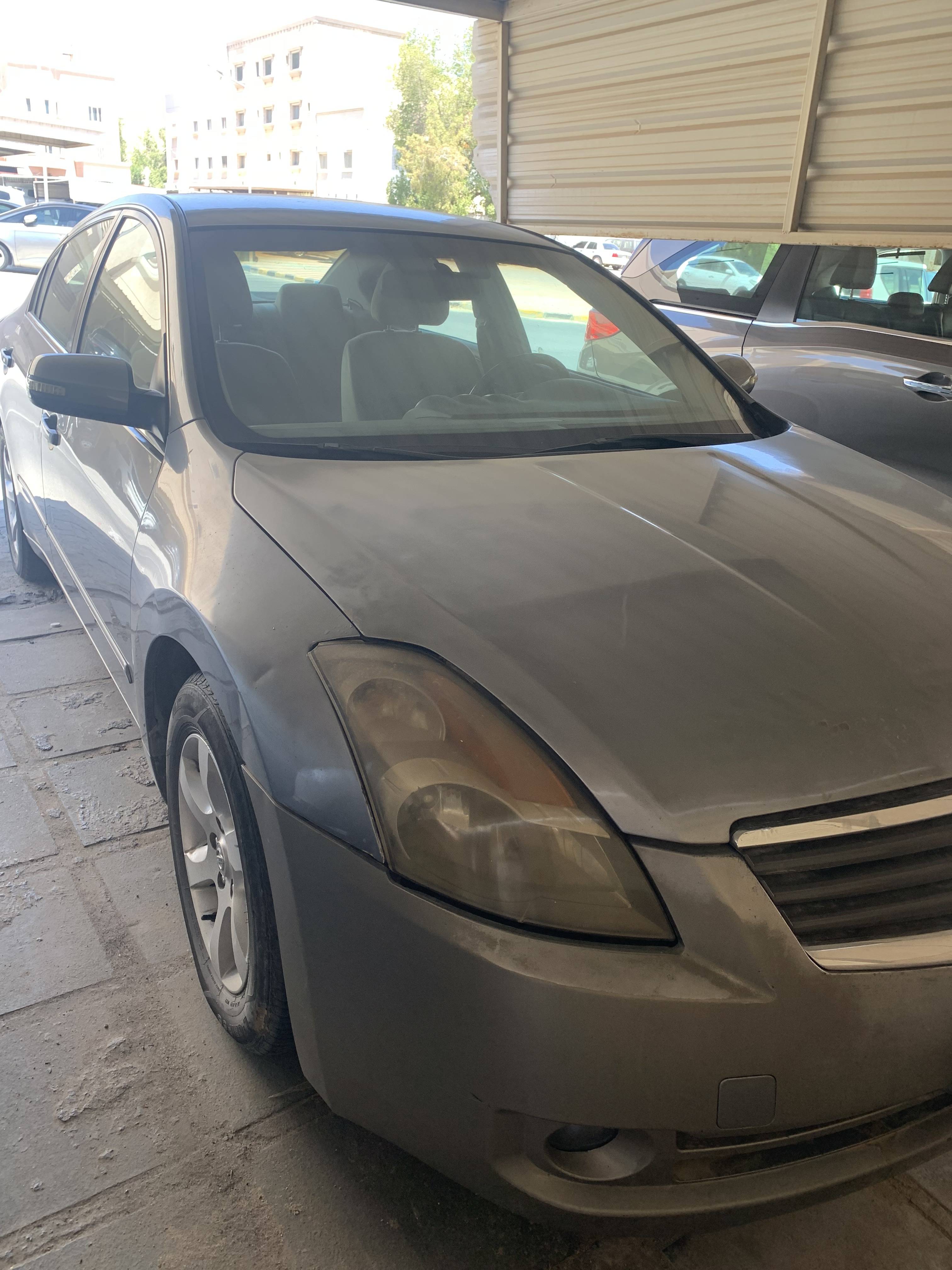 Nissan التيما 2009 - front-left photo 2