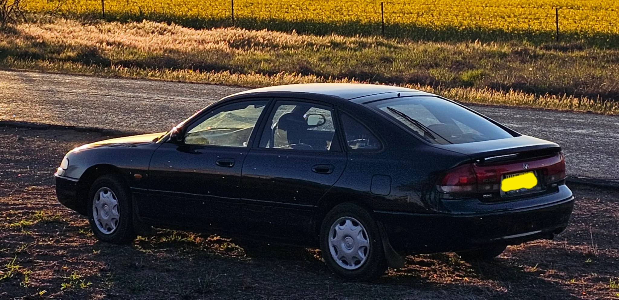 Mazda 626 1996 - rear-right photo 3