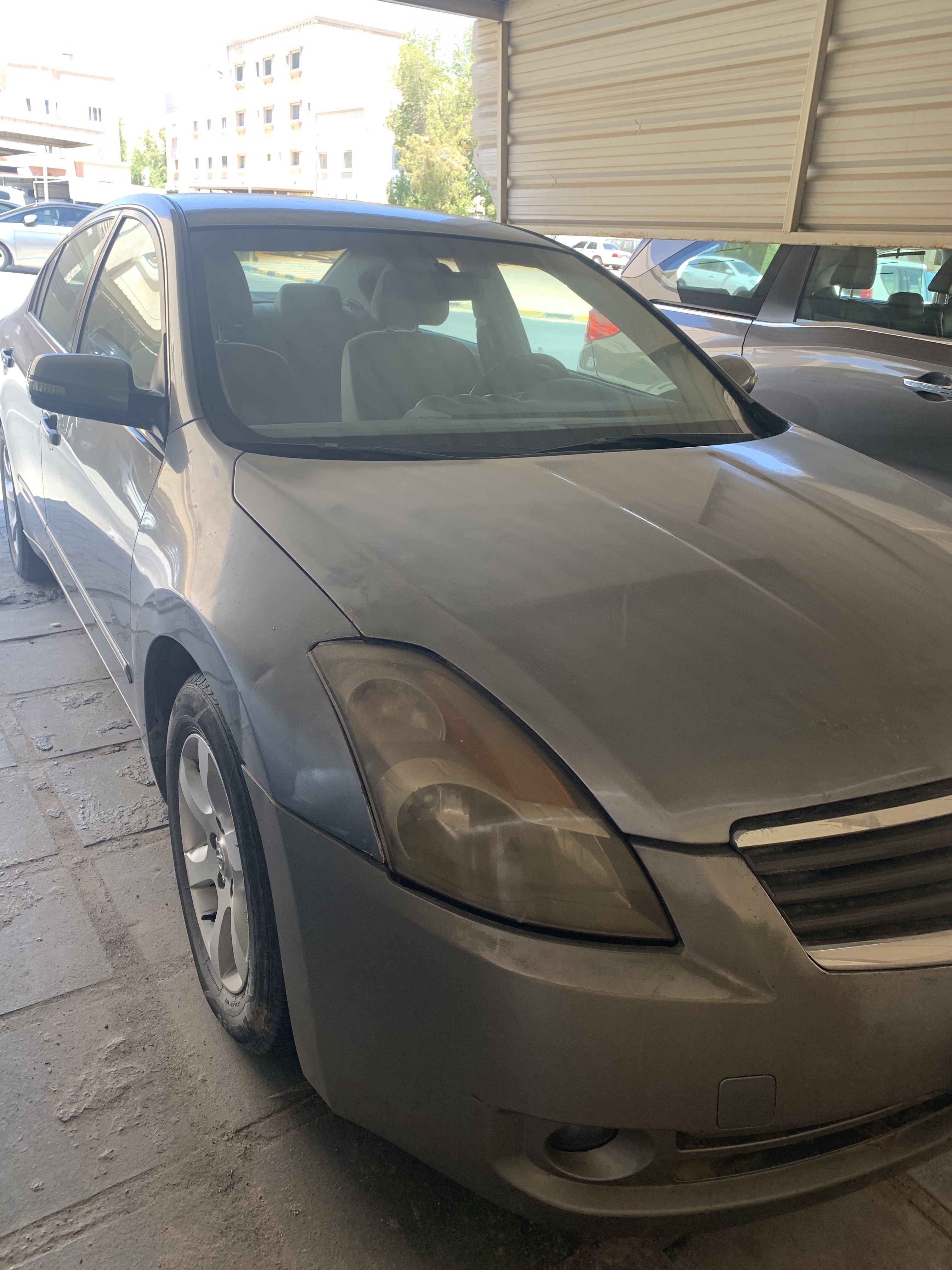 Nissan التيما 2009 - front-left photo 2