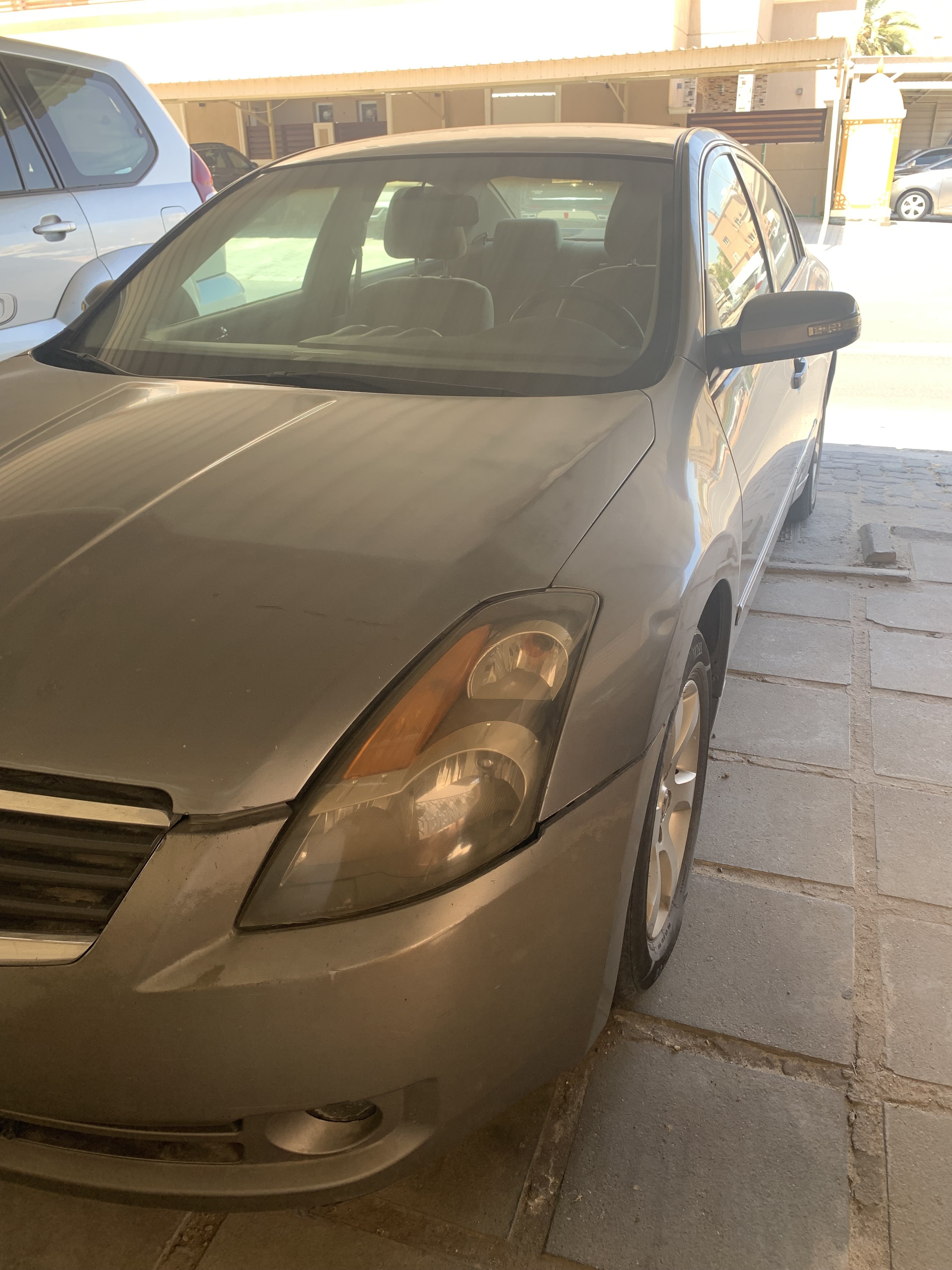 Nissan التيما 2009 - front-left photo 1