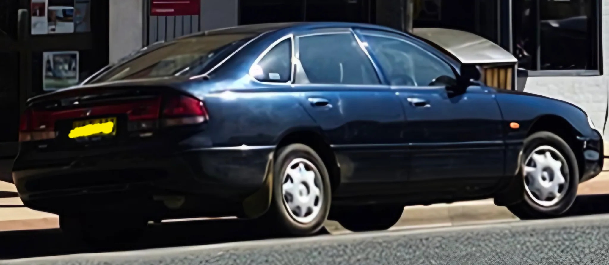 Mazda 626 1996 - rear-right photo 4