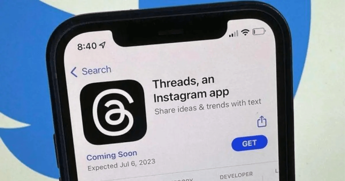 Photo of an iphone with the IOS App Store, showing a 'coming soon' screen for the Threads app, with saying Launchy date expected July 6, 2023