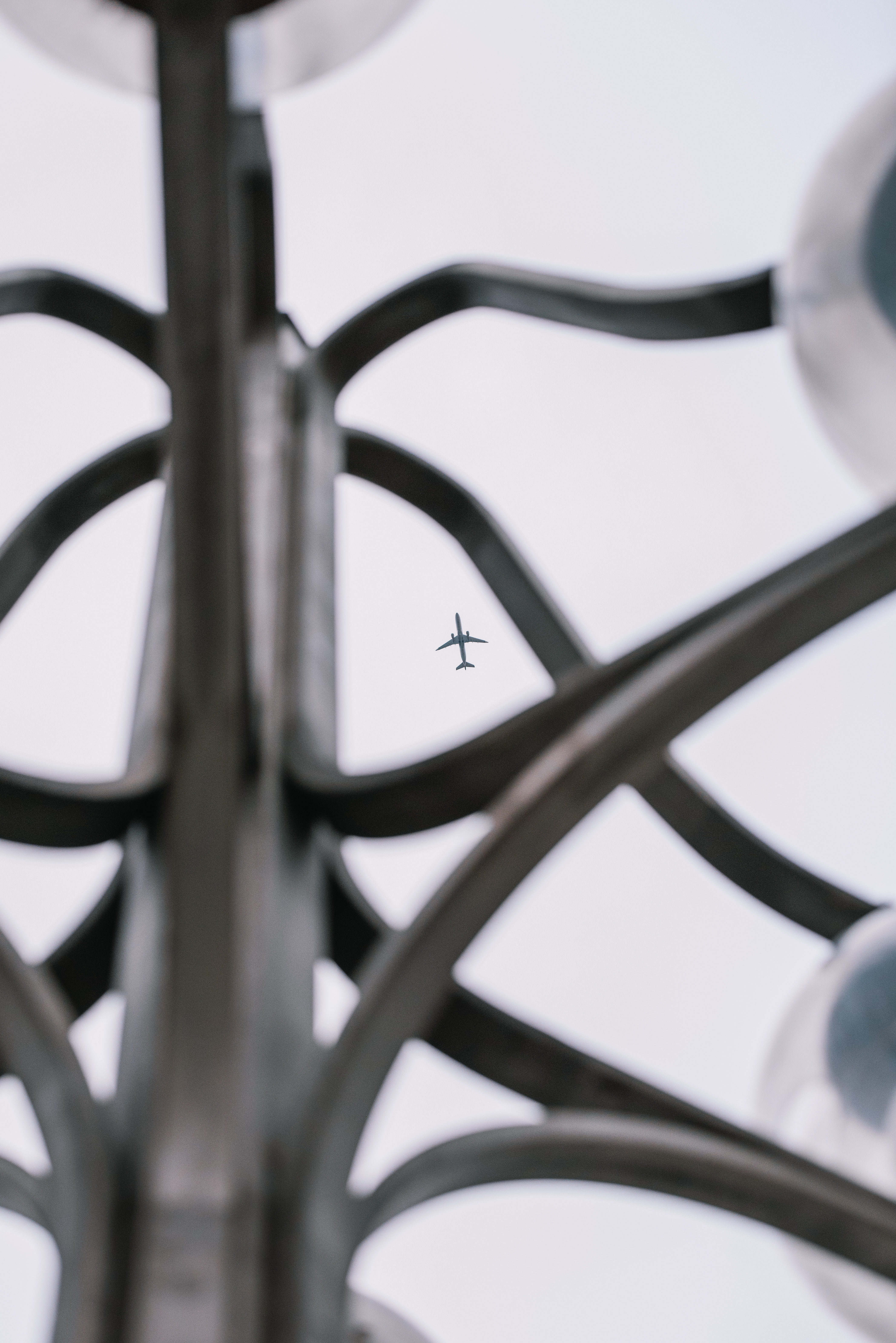 Plane through light post
