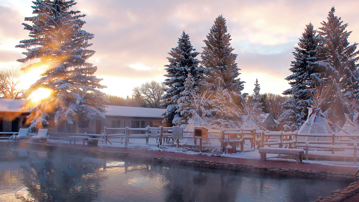 Sunset over Saratoga Hot Springs, a romantic getaway spot in Wyoming, during the winter