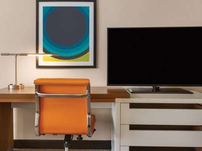 desk + chair + tv in guest room