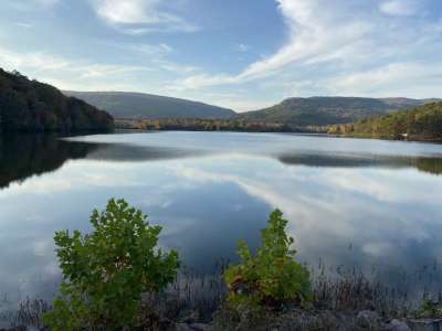 Beautiful view of lake with mountains in the background.