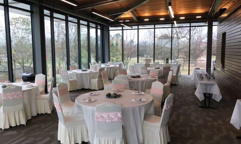 Tables and chairs set up for a reception in the Visitor Center Meeting Room at Jacksonport State Park