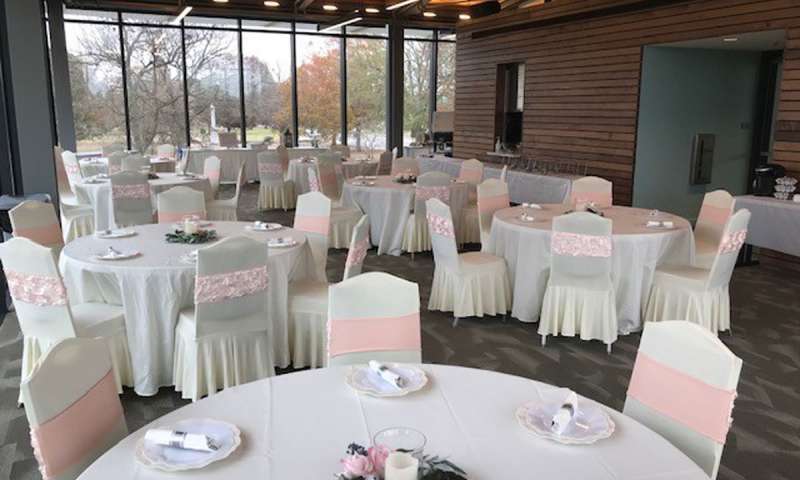 Tables and chairs set up for a reception in the Visitor Center Meeting Room at Jacksonport State Park