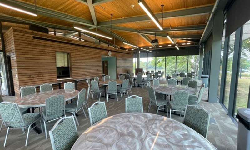 Tables and chairs set up for a reception in the Visitor Center Meeting Room at Jacksonport State Park