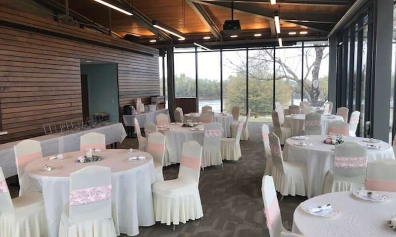 Tables and chairs set up for a reception in the Visitor Center Meeting Room at Jacksonport State Park