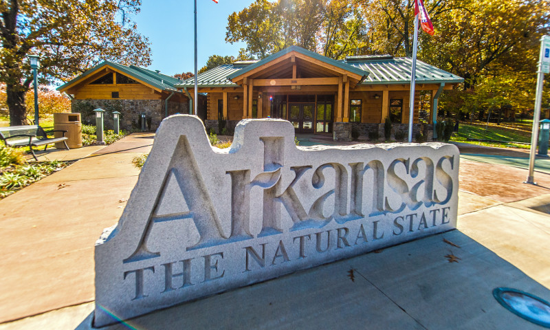 Large stone marker that reads "Arkansas The Natural State"