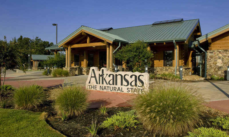 Large stone marker that reads "Arkansas The Natural State"