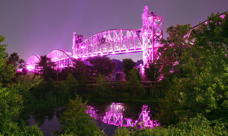 The Clinton Presidential Park Bridge glows at night
