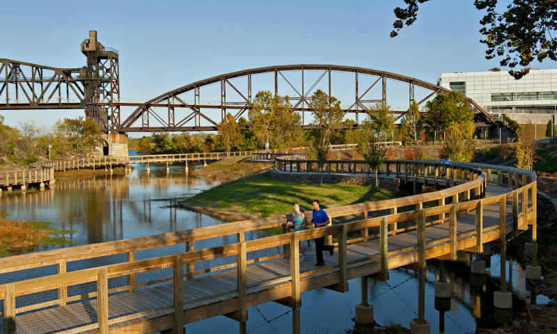The Bill Clark Presidential Park Wetlands are situated alongside the Arkansas River with views of the Clinton Presidential Center