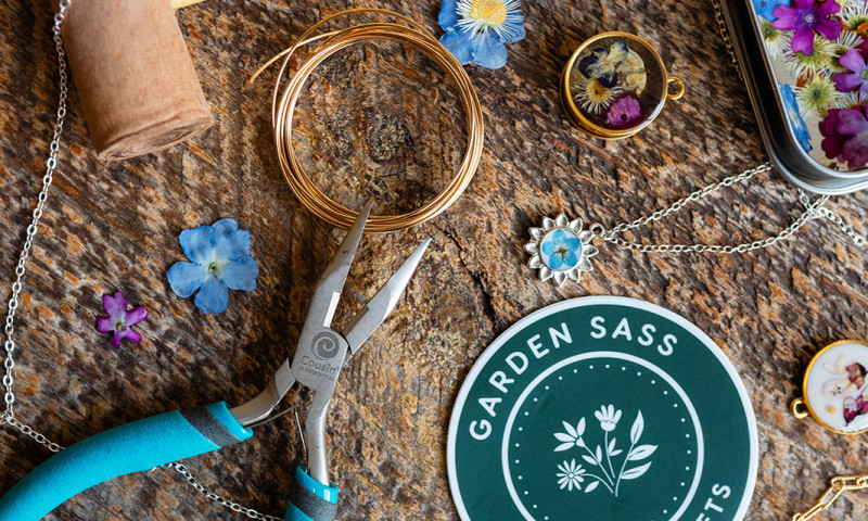 Jewelry tools and supplies, finished necklace, Garden Sass sticker.