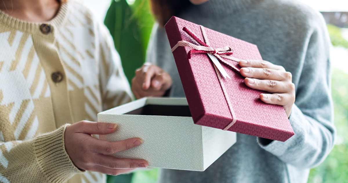Family surprising Mom with a keepsake slideshow video book on Mother's Day