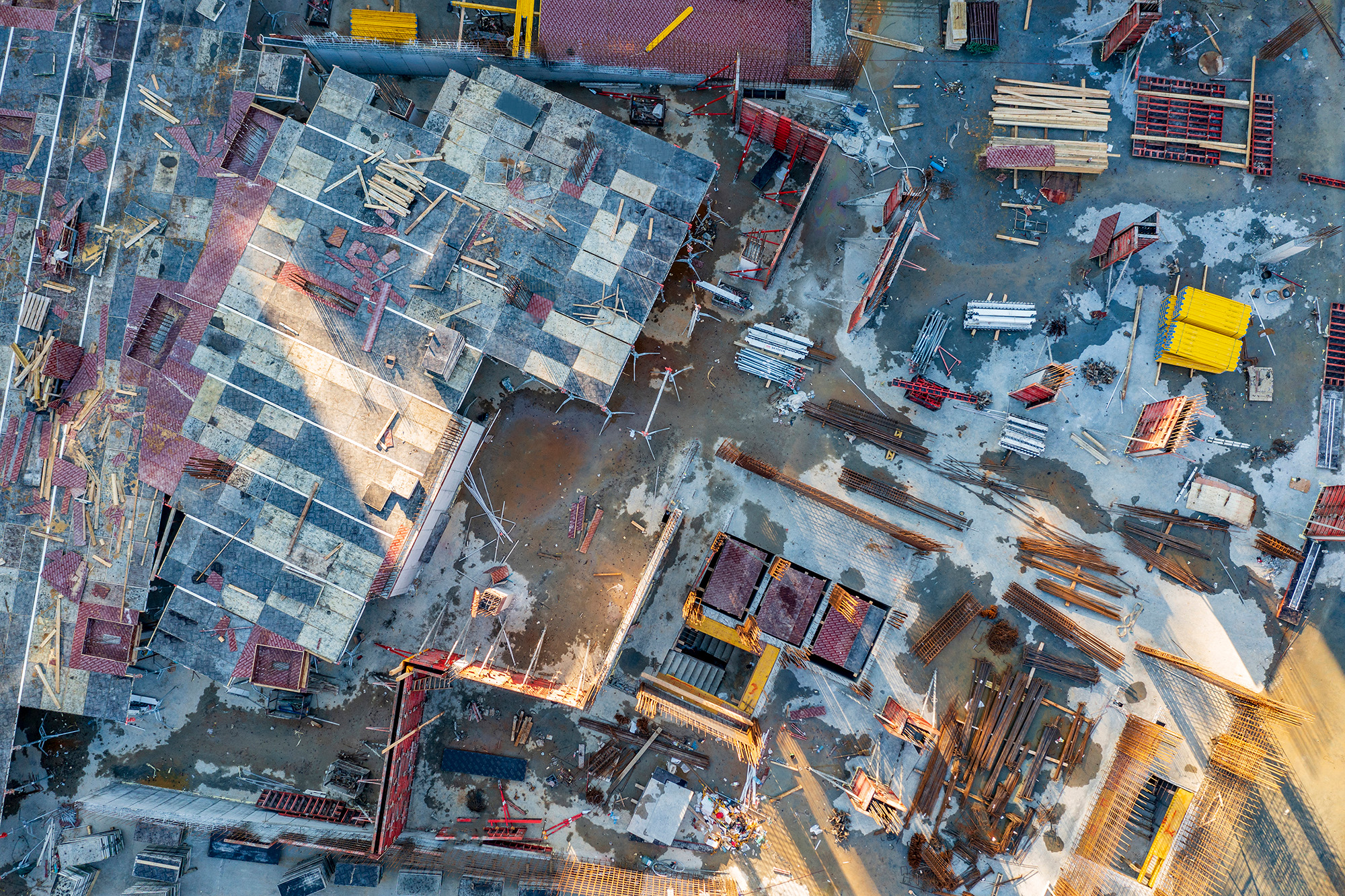 Drone scanning a construction site with 3D overlay
