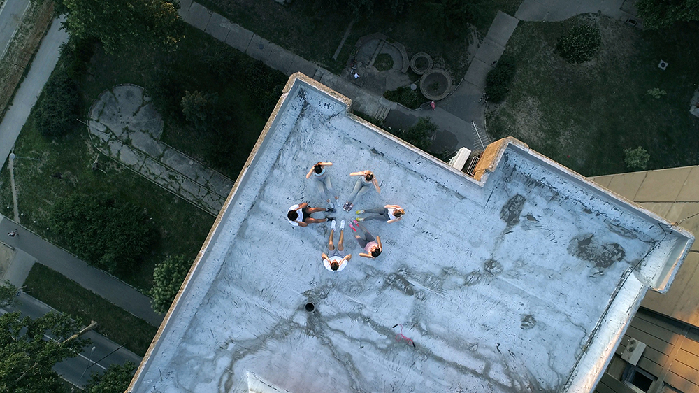 Film students using drone at outdoor event