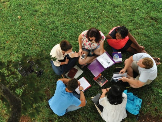 Milligan students studying on the library lawn