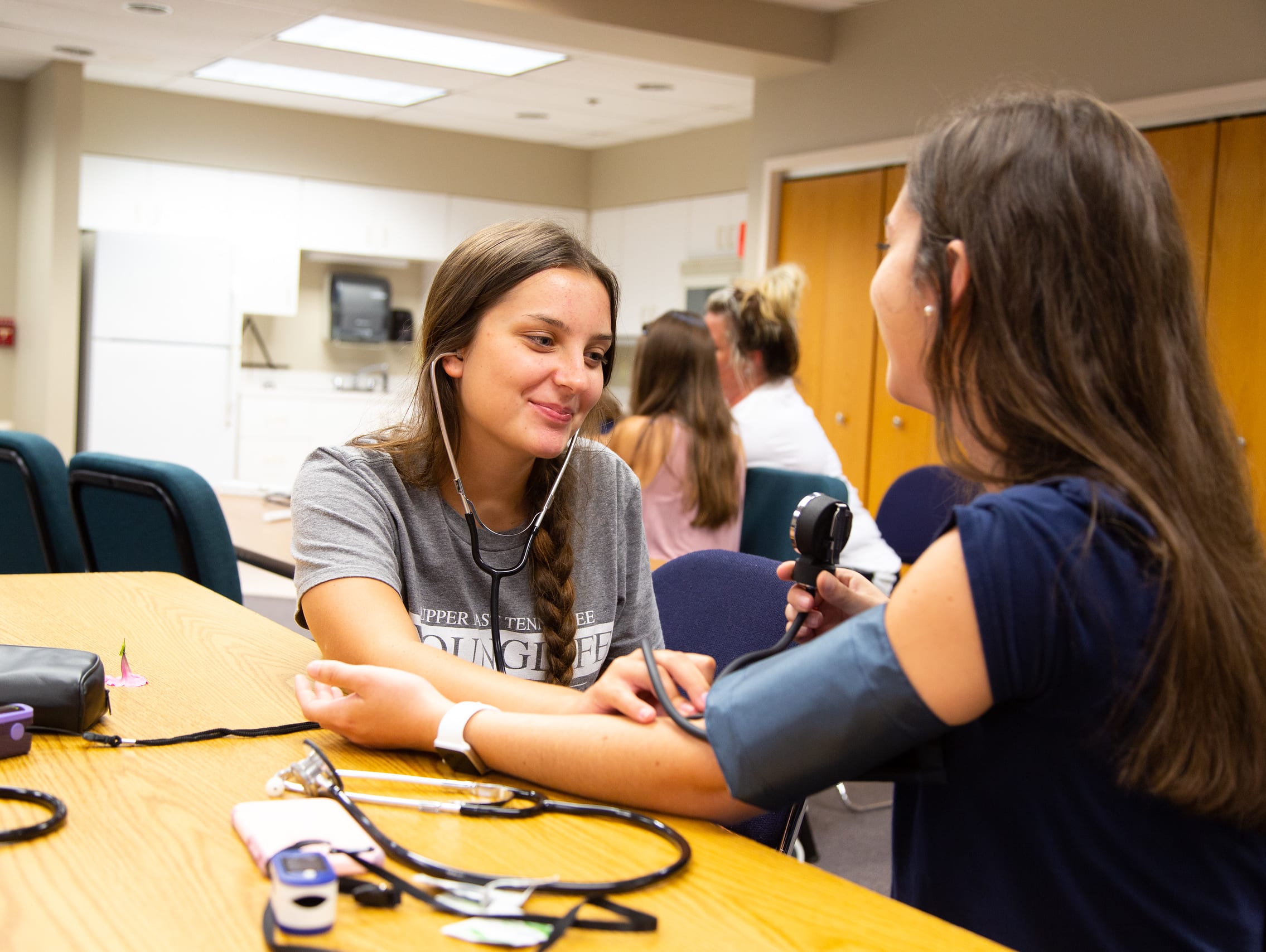 Students Checking Blood Pressure - Health & Safety