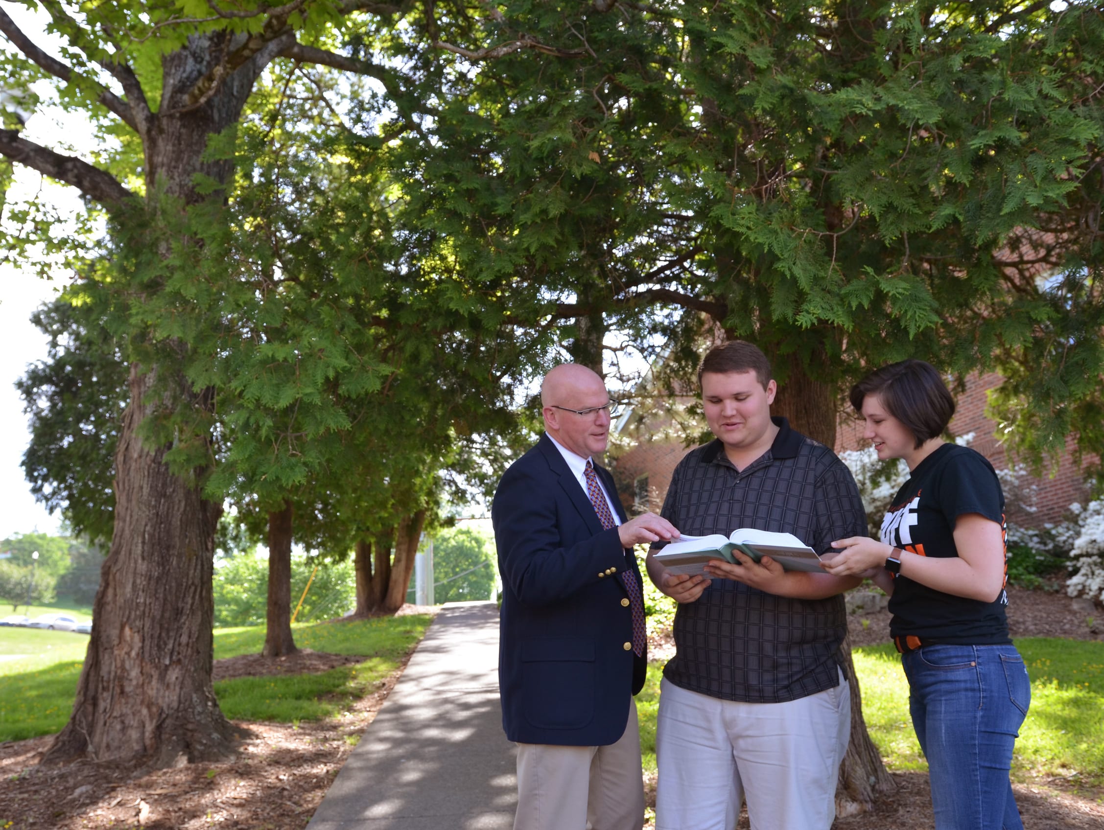 Students & Faculty Outside Sharing Faith